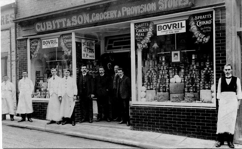 Photograph. Cubitt & Sons Grocers, 6 Kings Arms Street, North Walsham. Reggie ran the Grocers whilst Hugh ran the Drapers on the Market Place. (North Walsham Archive).