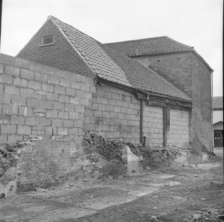 Photograph. Demolition of buildings on corner of Mundesley Road and Vicarage Street (North Walsham Archive).